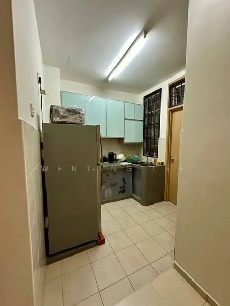 Kitchen features: light blue cabinetry, grey fridge, ceramic tile flooring, countertop, sink, wall-mounted shelves, window with metal grille, kitchen appliances on countertop.