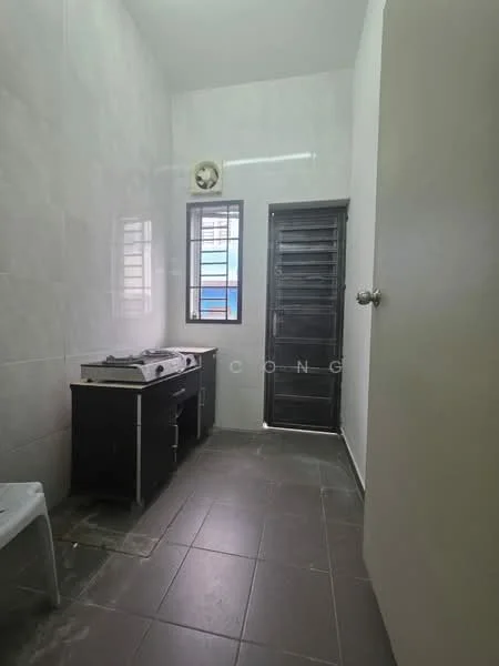 Room features: grey tiled flooring, white tiled walls, single window with metal grille, black door, black cabinet with countertop, exhaust fan on ceiling, light fixture on ceiling; style: modern.