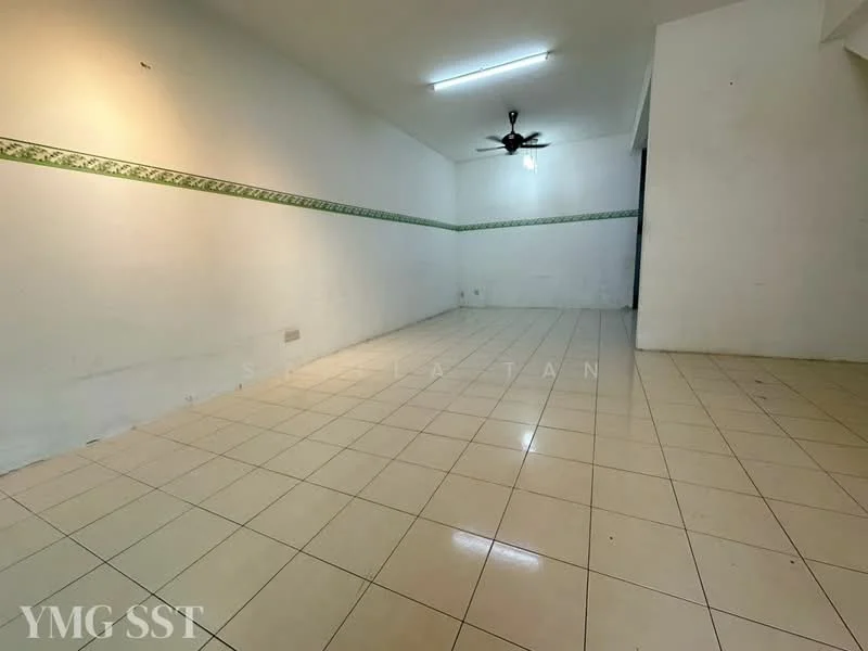 Room features: white painted walls, cream tiled flooring, ceiling fan, fluorescent ceiling light, green decorative wall trim, empty space.