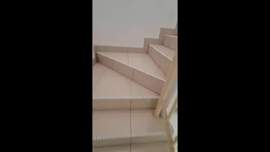 Room features: tiled flooring, staircase with tiled steps, handrail, neutral wall color, corner staircase design.