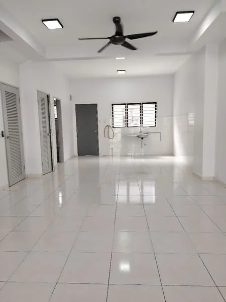 Room features: white painted walls, white ceiling, recessed downlights, 5-blade ceiling fan, glossy white floor tiles, two grey doors, one grey wall-mounted sink, three windows with black grilles, open layout, no visible furniture; style: modern.