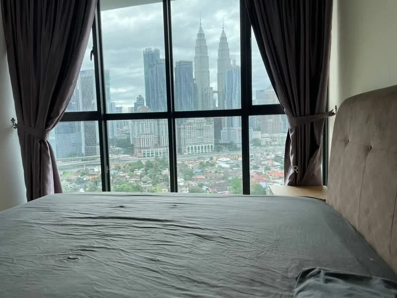 Bedroom features: king-size bed, upholstered headboard, floor-to-ceiling windows, grey curtains, wooden bedside table, city skyline view; style: modern; view: city.