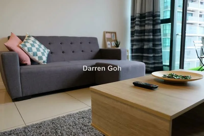 Living features: grey fabric sofa with tufted back, two decorative cushions in pink and blue, wooden coffee table, decorative bowl on coffee table, remote control on coffee table, large glass sliding door, curtains with a grey and white pattern, glossy tiled flooring, wall-mounted artwork, indoor plants visible through the sliding door; style: modern; view: city.