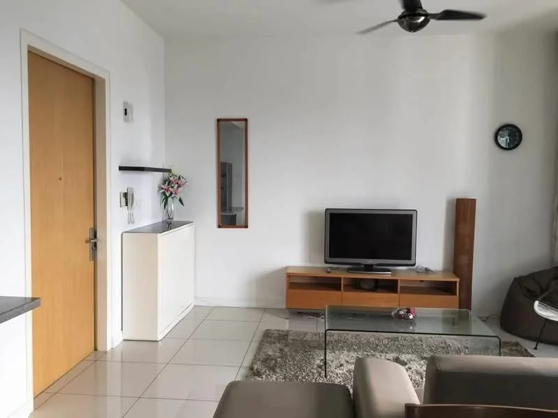 Living features: white painted walls, glossy tile flooring, 5-blade ceiling fan, wall-mounted TV, wooden TV console, glass coffee table, area rug, decorative mirror, side table, door with wood finish, wall clock, decorative flowers in vase; style: modern.