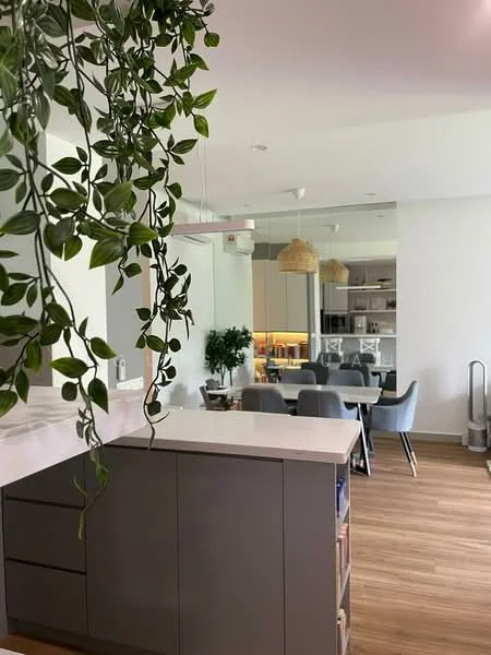 Kitchen features: grey cabinetry, white countertop, hanging pendant light, open shelving, greenery decor, stainless-steel appliances, wooden flooring, recessed lighting; style: modern; view: dining. Dining features: 6-seater dining table, upholstered dining chairs, decorative plant, pendant lighting, open layout; style: modern; view: kitchen.