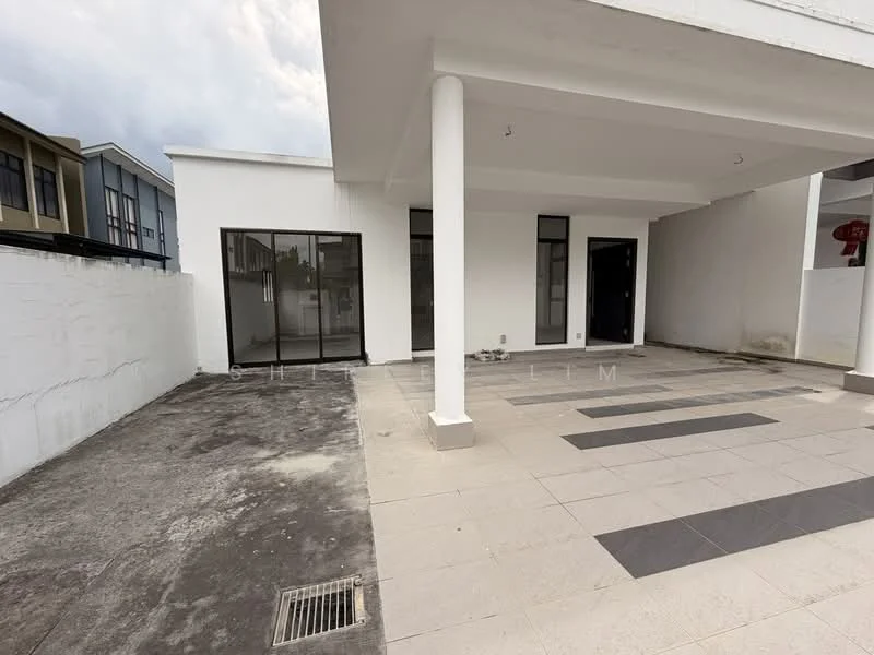 Exterior type: detached bungalow; features: white painted facade, flat roof, paved outdoor area, concrete flooring, manicured lawn, single-storey, large windows, double doors, surrounding wall, open space, minimal landscaping; style: modern.