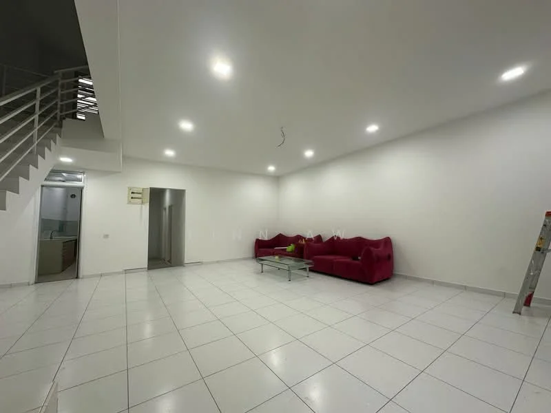 Living features: white painted walls, white ceiling, recessed downlights, large red fabric sofa, glass coffee table, white tiled flooring, open layout, staircase visible in background; style: modern.