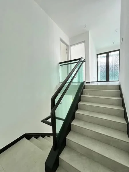 Room features: staircase with glass railing, light grey tile flooring, white painted walls, large windows, natural light, modern design, black trim on stairs, open space; style: modern; view: garden.