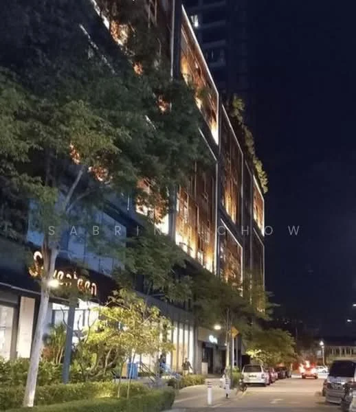 Exterior type: mid-rise condominium; features: glass curtain wall, illuminated facade, recessed balconies, landscaped greenery, street-level retail, outdoor seating area, paved walkway, urban context with street view; style: modern.