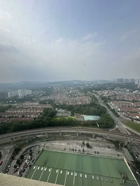 Exterior type: high-rise condominium; features: city skyline view, surrounded by residential areas, highway visible, greenery in the foreground, multi-storey buildings in the background, parking area visible; style: modern.