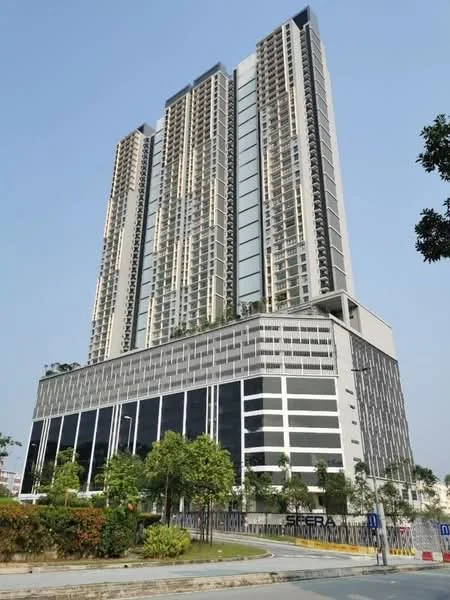 Exterior type: high-rise condominium; features: glass curtain wall, white painted facade, greenery on balconies, multiple storeys, manicured landscaping, parking deck, modern architectural design, surrounded by trees, elevated structure, balconies with glass railings; style: modern.