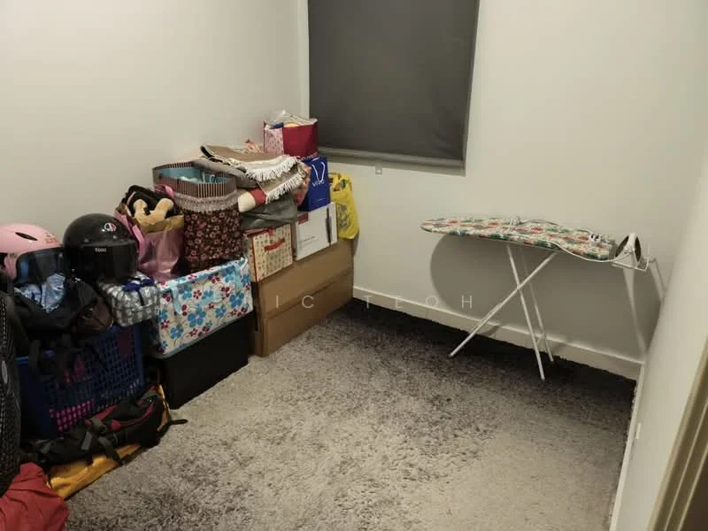 Room features: grey carpet flooring, white painted walls, ironing board, storage boxes, plastic storage bins, various bags, helmet, window with roller blind.