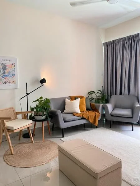 Living features: grey fabric 3-seater sofa, light grey armchair, wooden armchair with white cushion, round black side table, decorative throw pillow in mustard, beige area rug, floor lamp with black shade, potted plants, curtains in grey fabric, ceiling fan, white painted walls, glossy tile flooring; style: modern.
