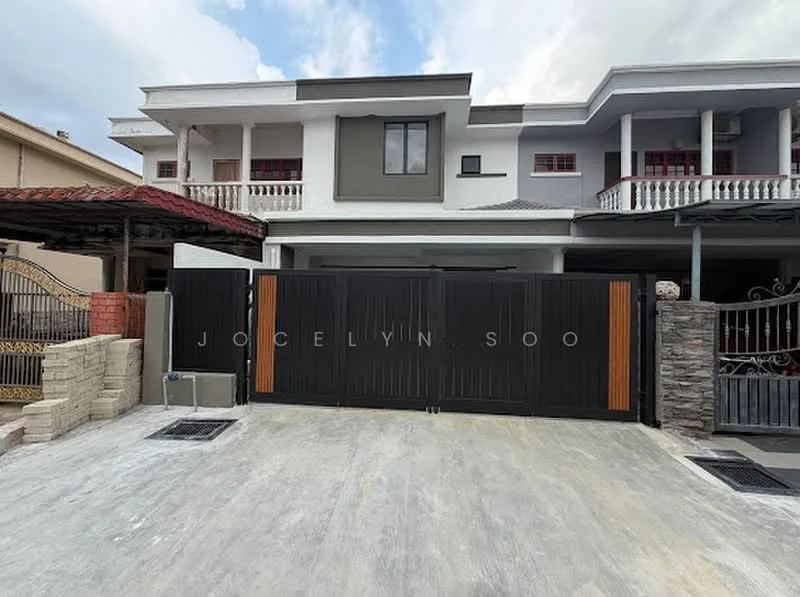 Exterior type: semi-detached house; features: black metal gate with wooden accents, stone cladding on gate pillars, concrete driveway, manicured lawn, two-storey facade, balconies on upper floor, red-tiled roof, white painted walls, decorative wrought iron details, visible air conditioning units; style: modern.