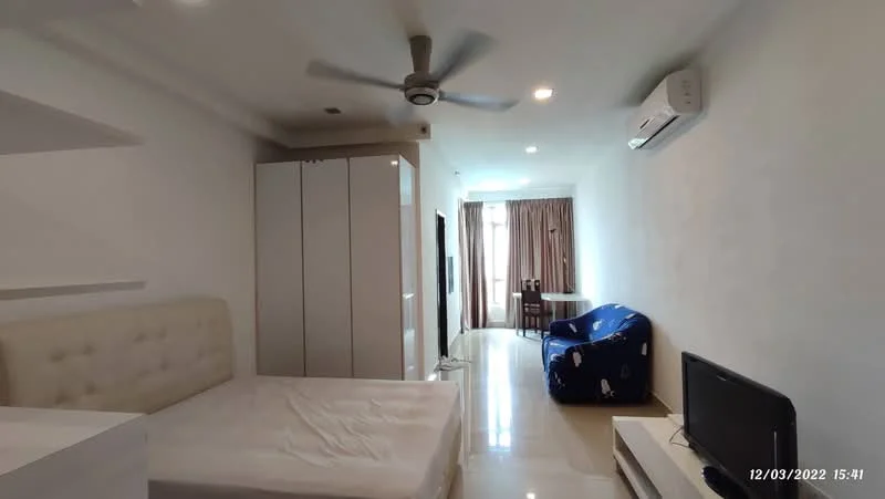 Room features: white painted walls, glossy tile flooring, 5-blade ceiling fan, wall-mounted air conditioning unit, queen-size bed frame without mattress, built-in wardrobe with sliding doors, TV console with TV, blue fabric armchair, dining table with chairs, curtains on window; style: modern.