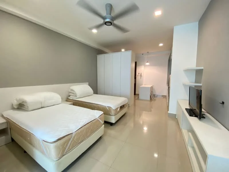 Bedroom features: two single beds with mattresses, white bedding, grey accent wall, white painted walls, glossy tile flooring, ceiling fan, built-in wardrobe with sliding doors, TV console with wall-mounted TV, recessed lighting, open space layout; style: modern.