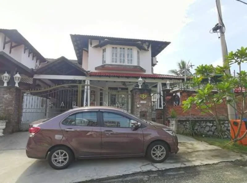 Exterior type: detached bungalow; features: brick facade, white painted trim, red tiled roof, front porch with railing, manicured lawn, paved driveway, landscaped garden with tropical plants, security gate, outdoor lighting fixtures, two-storey structure; style: traditional.