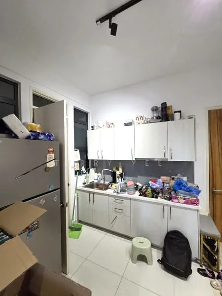 Kitchen features: grey cabinetry, stainless-steel fridge, single-bowl stainless-steel sink, chrome pull-down faucet, white tiled backsplash, countertop with clutter, kitchen utensils and appliances visible, white ceramic floor tiles, track lighting, green cleaning bucket, stool, black backpack, boxes with items; style: modern.