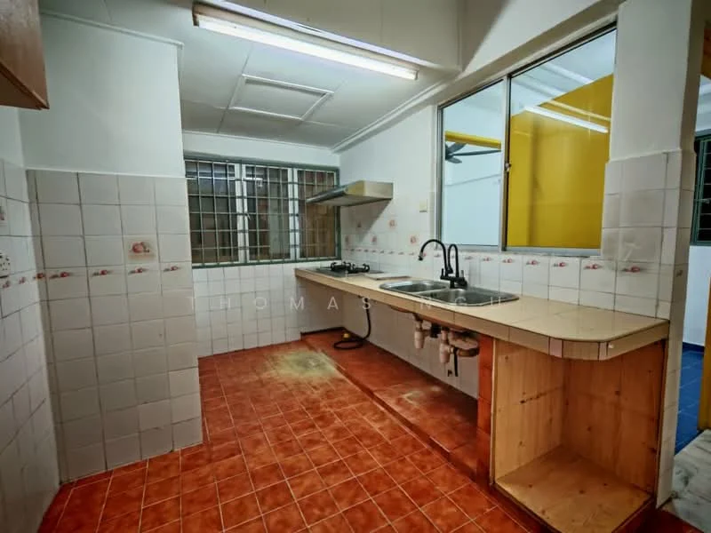 Kitchen features: double-bowl stainless-steel sink, chrome pull-down faucet, laminate countertop, white tiled walls, red terracotta tile flooring, built-in gas hob, wood cabinetry, large window for natural light, open layout, exposed plumbing under sink.