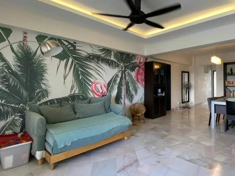 Living features: 3-seater fabric sofa in light blue, marble flooring, tropical wallpaper with palm leaves and flowers, ceiling fan, recessed lighting, decorative floor lamp, wooden coffee table, woven chair, open layout to dining area; style: modern.