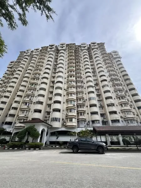 Exterior type: high-rise condominium; features: cream painted facade, recessed balconies, multiple storeys, curved architectural design, landscaped entrance, parking area visible, surrounded by greenery; style: modern.