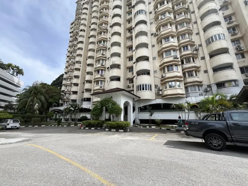 Exterior type: high-rise condominium; features: white painted facade, curved balconies, multiple storeys, landscaped garden, paved parking area, surrounded by palm trees, entrance with awning, visible parking spaces; style: modern.