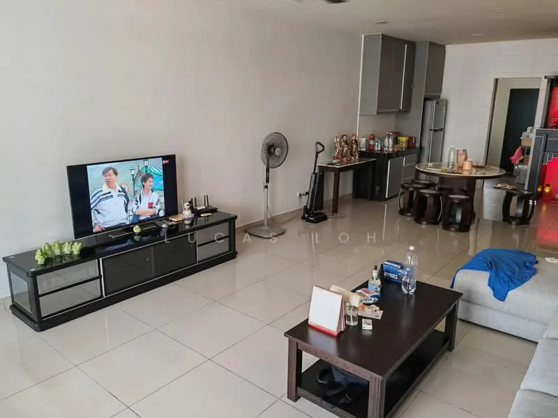 Living features: white painted walls, glossy tile flooring, sofa in light grey fabric, coffee table in dark wood, TV console in dark wood, wall-mounted TV, standing fan, decorative plants on console, open shelving with decorative items, dining table with high chairs in background, refrigerator visible in background; style: modern.