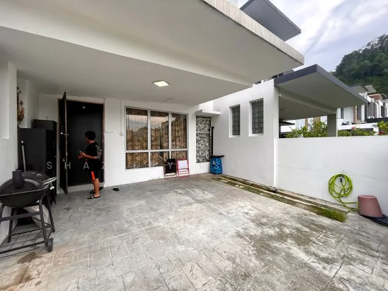 Exterior type: linked terrace house; features: white painted facade, flat roof, concrete flooring, manicured lawn, garden hose visible, outdoor seating area, entrance door, large windows, stone-paved walkway; style: modern.