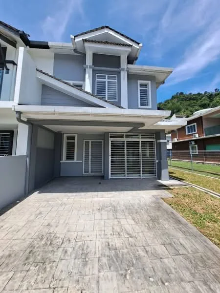 Exterior type: semi-detached house; features: grey painted facade, gabled roof, sliding glass door, horizontal louvered windows, concrete driveway, manicured lawn, surrounded by greenery, two-storey structure; style: modern.
