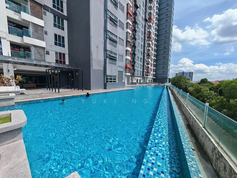 Exterior type: high-rise condominium; features: infinity pool, pool deck with loungers, glass railing, landscaped garden area, concrete facade, balconies with glass panels, tiled pool edge, surrounded by greenery, urban skyline in background; style: modern.