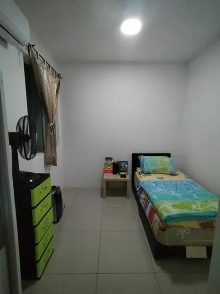 Bedroom features: single bed with colorful bedding, nightstand, green storage drawers, wall-mounted air conditioning unit, ceiling light, tiled flooring, curtains on window, fan on stand.