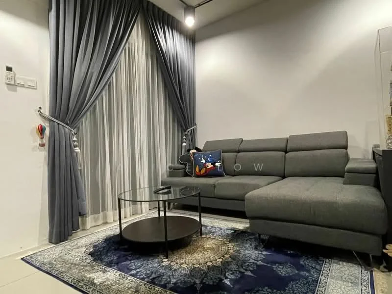 Living features: grey fabric sectional sofa, round black coffee table, area rug with intricate pattern, floor-to-ceiling windows, sheer curtains, dark grey curtains, wall-mounted light fixture, decorative throw pillow; style: modern.