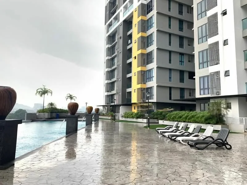 Exterior type: high-rise condominium; features: swimming pool, pool deck with loungers, landscaped garden, concrete flooring, potted plants, glass windows, balconies, yellow accent wall, modern facade, multiple storeys; style: modern.