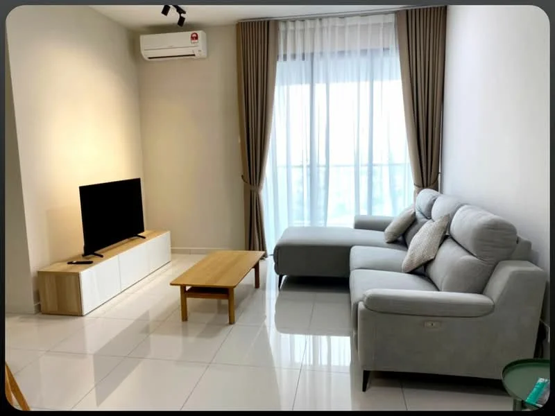 Living features: grey fabric L-shape sectional sofa, light wooden coffee table, wall-mounted flat-screen TV, white TV console with storage, floor-to-ceiling windows, sheer curtains, white painted walls, glossy white tile flooring, 1 wall-mounted split AC, decorative throw pillows; style: modern; view: city.