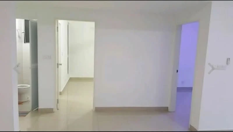 Room features: white painted walls, cream tiled flooring, doorway leading to bathroom, doorway leading to another room, neutral lighting, no visible furniture, minimalist decor, open layout; style: modern.