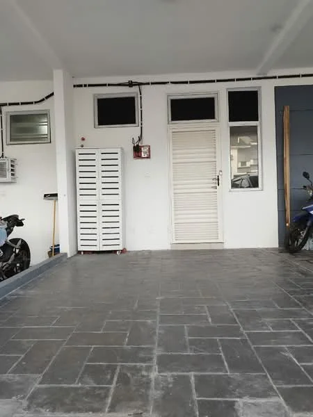 Exterior type: car porch; features: paved flooring, white painted walls, single door entrance, two windows, storage cabinet, wall-mounted fire alarm, motorcycles parked, grey accent wall; style: modern.
