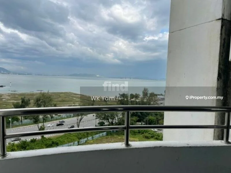Room features: balcony with railing, sea view, cloudy sky, greenery in the foreground, road visible below; view: sea.