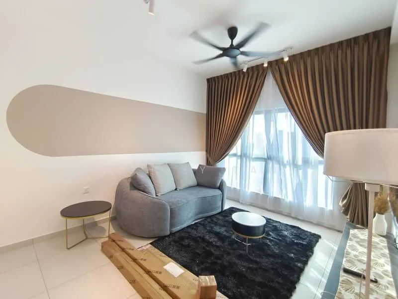 Living features: grey fabric sofa, black area rug, round coffee table with gold base, floor-to-ceiling windows, sheer curtains, dark brown curtains, ceiling fan with light, white painted walls, accent wall with beige paint, decorative lamp; style: modern.