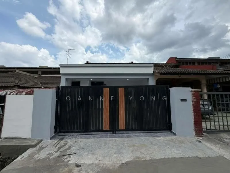 Exterior type: linked terrace house; features: black metal gate with wooden accents, grey painted facade, concrete driveway, single-storey structure, roof with overhang, surrounded by residential buildings, visible sky with clouds; style: modern.