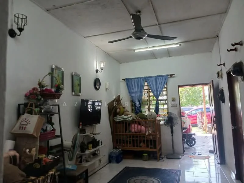 Living features: white painted walls, polished tile flooring, exposed ceiling beams, 5-blade ceiling fan with light, wall-mounted TV, wooden TV console, sofa with decorative cushions, area rug with geometric pattern, decorative wall sconces, wooden shelving unit, window with blue curtains, door leading outside; style: modern; view: garden.
