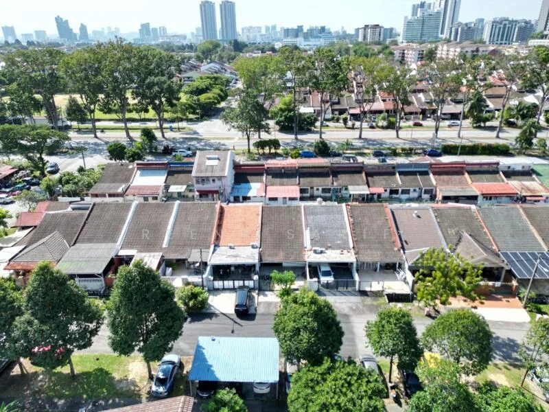 Exterior type: linked terrace house; features: single-storey linked terrace houses, red and brown tiled roofs, manicured lawns, mature trees, paved driveway, surrounded by greenery, urban context with city skyline in background; style: modern.