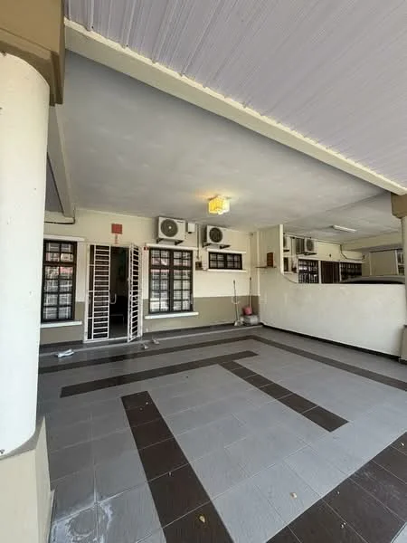 Room features: grey tiled flooring, black tiled flooring, white painted walls, exposed ceiling, 2 wall-mounted split AC units, light fixture on ceiling, window with security bars, doorway leading to another room, clean and uncluttered space; style: modern.