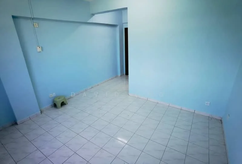 Room features: light blue painted walls, white tiled flooring, corner with electrical outlet, single plastic stool, open space layout; style: minimalist.