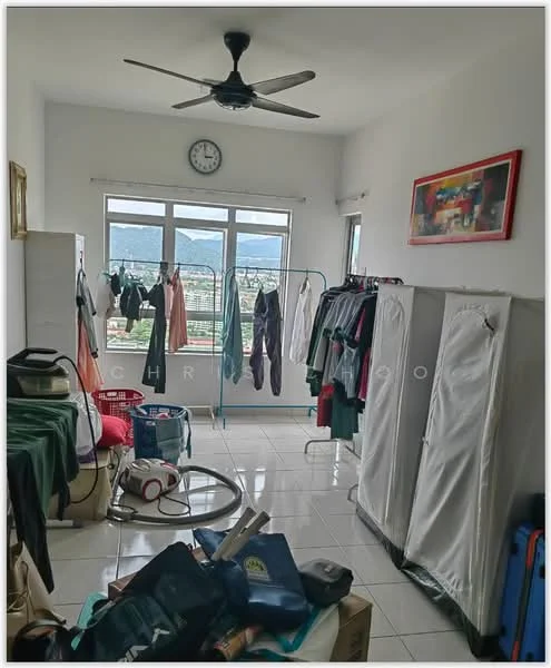 Room features: white painted walls, tiled flooring, 5-blade ceiling fan, floor-to-ceiling windows, curtains, clothes drying rack, wardrobe with sliding doors, various items on the floor including bags and a vacuum cleaner, wall clock, framed artwork; view: city.