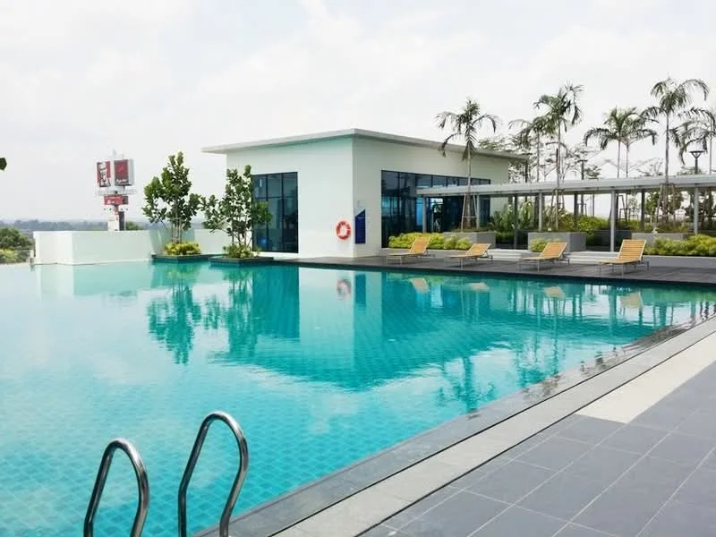 Exterior type: clubhouse; features: infinity pool, pool deck with loungers, landscaped garden, palm trees, glass facade, outdoor seating area, lifebuoy, tiled pool surface, surrounding greenery; style: modern.
