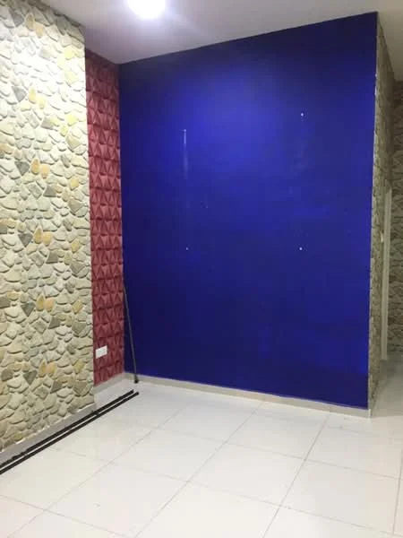 Room features: white tiled flooring, blue painted wall, textured stone feature wall with yellow accents, textured red feature wall, ceiling light fixture; style: modern.