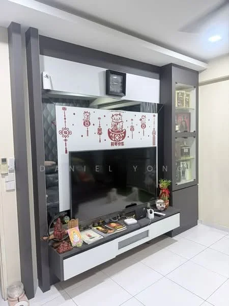 Living features: white tiled flooring, grey accent wall, built-in TV console, black flat-screen TV, decorative wall art, glass display cabinet, shelves with decorative items, recessed ceiling lights; style: modern.