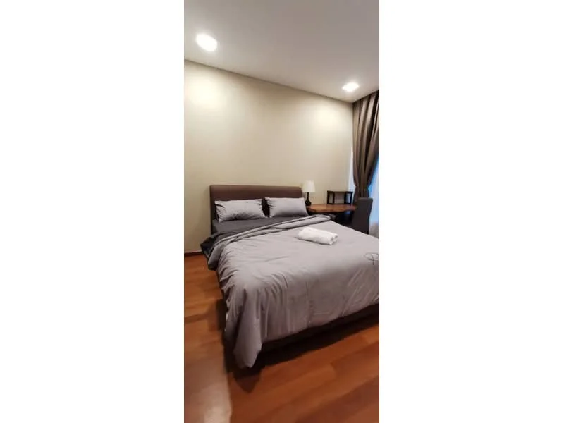 Bedroom features: queen-size bed with grey bedding, wooden headboard, bedside table with lamp, curtains, wooden flooring, recessed ceiling lights, decorative pillows, blanket on bed; style: modern.