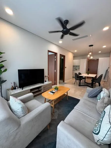 Living features: 3-seater fabric sofa in light grey, 2-seater fabric sofa in light grey, wooden coffee table, wall-mounted TV, TV console, ceiling fan with light, decorative cushions, area rug, indoor plant, recessed lighting, light grey painted walls, tile flooring; style: modern. Dining features: round dining table, 4 dining chairs, pendant lighting above table, open kitchen layout, light wood cabinetry, white countertops; style: modern.