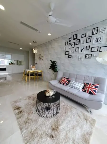 Living features: grey fabric sofa, 3-seater sofa, decorative cushions with Union Jack pattern, black coffee table, round coffee table with wire frame, area rug with fluffy texture, wall-mounted artwork in various frames, recessed ceiling lights, ceiling fan, large windows with natural light, potted plant, open layout to kitchen and dining area, marble tile flooring, textured accent wall; style: modern.